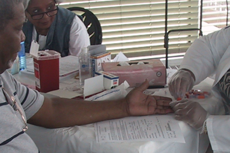 A nurse administering a blood test.